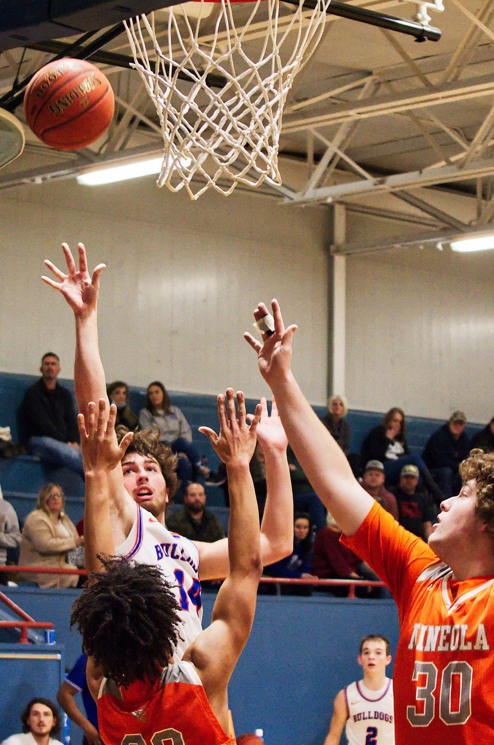 Aiden Corrier puts up a contested jumper in his final basketball game as a Bulldog. [more shots, score prints]